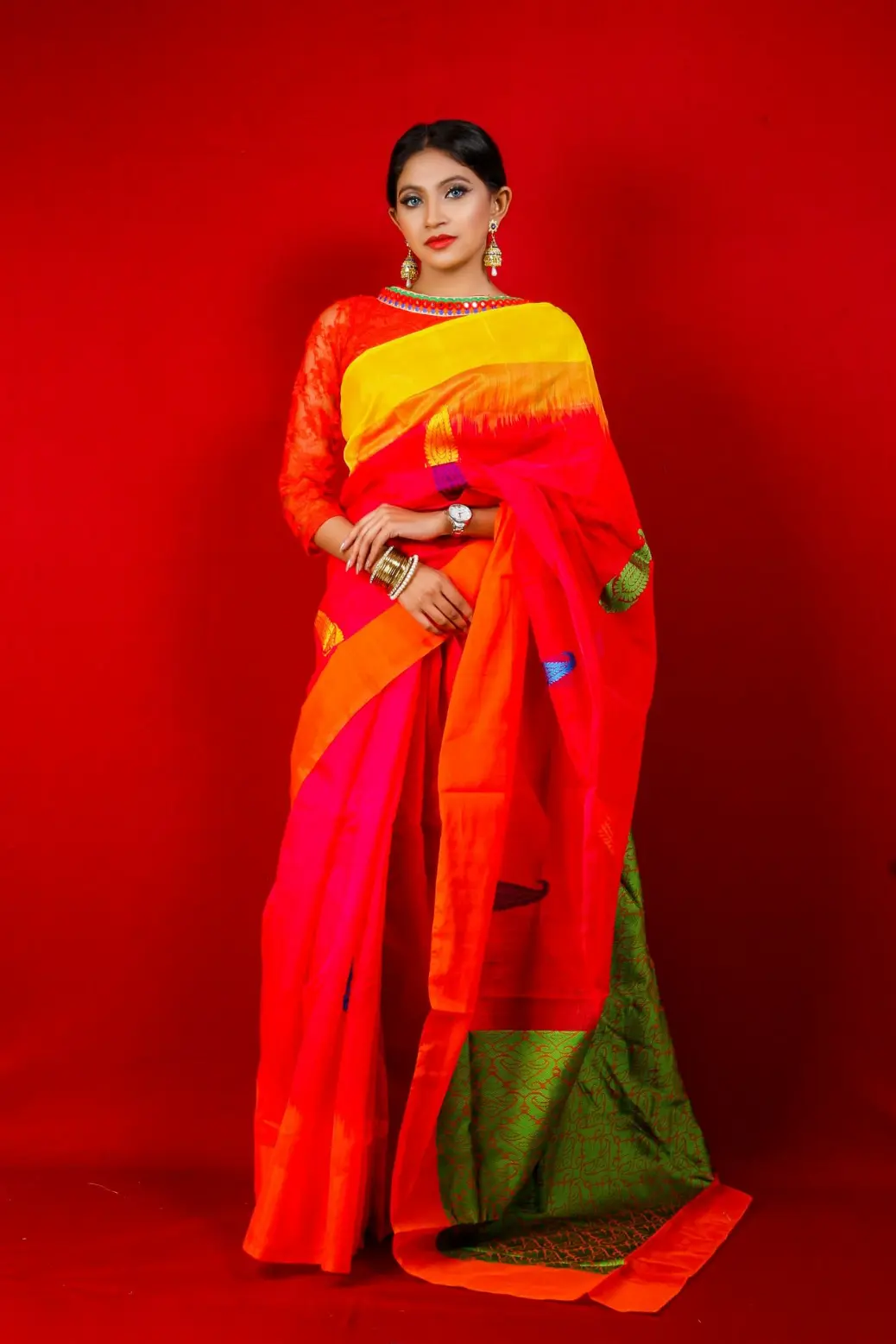 woman in red and green sari