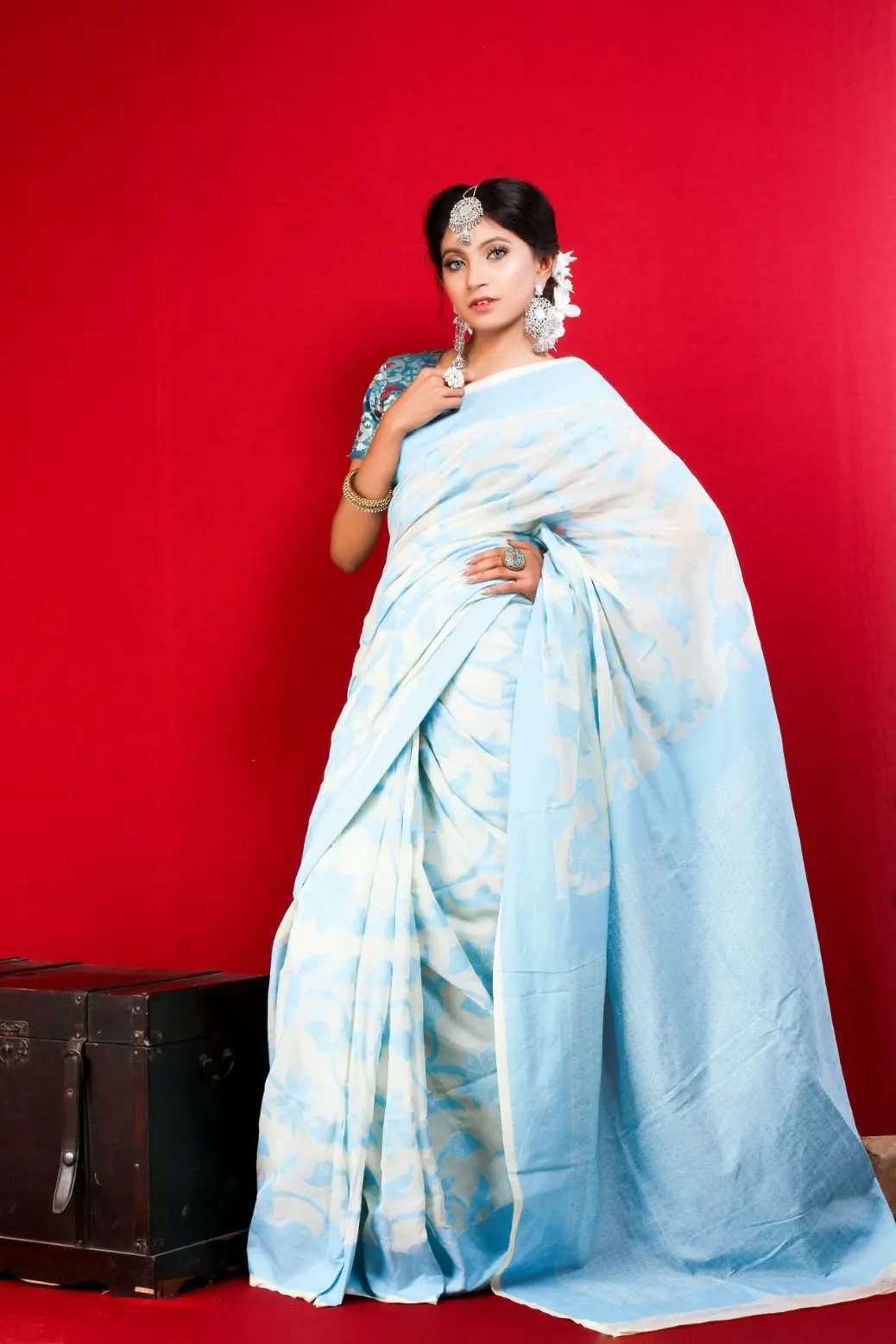 woman in white and blue floral dress